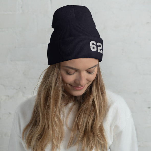 Women wearing navy blue beanie hat with number 62